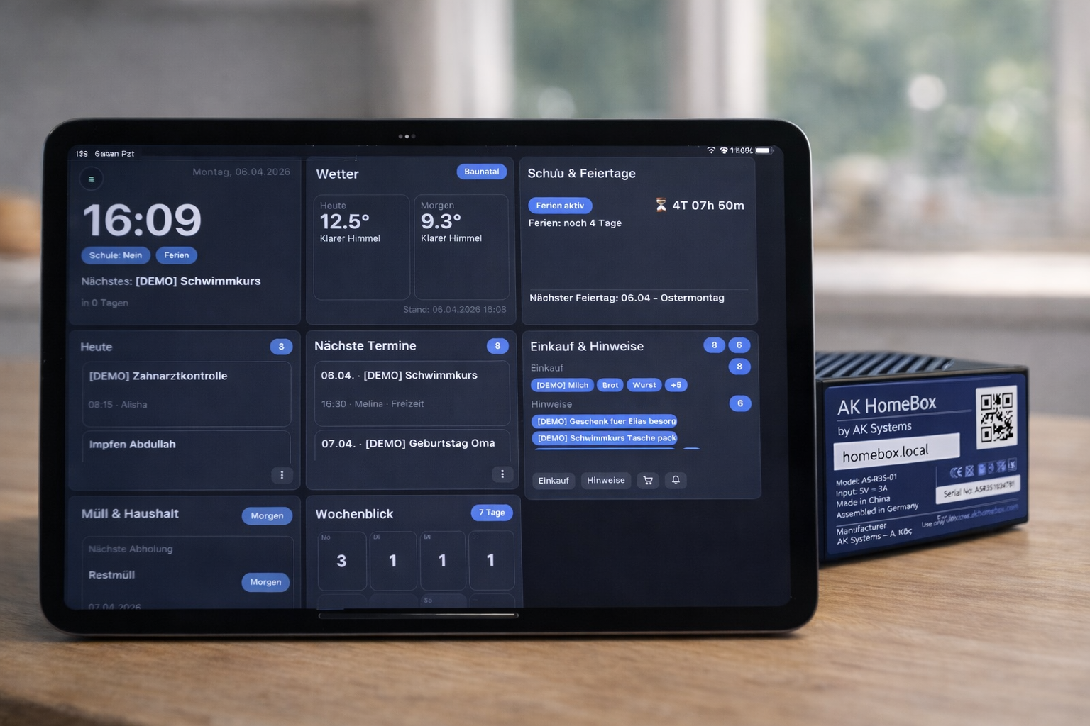 HomeBox next to a tablet with AK Homebox in the browser